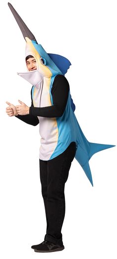 a man in a shark costume poses for the camera