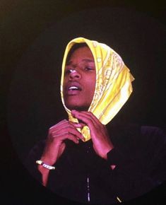 a woman wearing a yellow head scarf