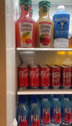 a refrigerator filled with lots of different types of drinks