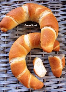 bread shaped like the letter s on top of a basket