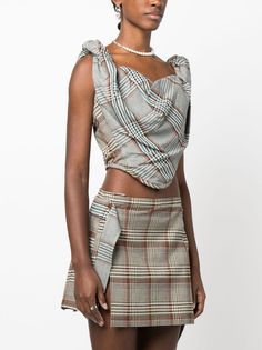 Sunday tartan-check corset top from VIVIENNE WESTWOOD featuring multicolour, tartan check pattern, corset style, sweetheart neck, draped detailing, sleeveless, low back, rear zip fastening and cropped. We've partnered with Good On You — an independent agency that rates how brands perform in relation to their impact on the planet, people and animals, with a multi-criteria rating simplified to a five points scale. In order to be awarded our conscious label, larger brands need to score a minimum of Pattern Corset, Vivienne Westwood Tops, Crepe Top, Corset Style, Cropped Style, Sweetheart Neck, Sweaters Knitwear, Emilio Pucci, Check Pattern