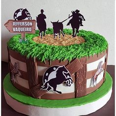 a birthday cake decorated with horses and people on top of the horse paddocks