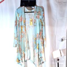 Aryeh Mint Green Cardigan With Colored Floral Design, Long Sleeve With Handkerchief Hem. Item 174 Mint Green Cardigan, Paisley Sweater, Sleeveless Tunic Tops, Tiered Tops, Floral Embroidered Top, Layered Blouse, Green Cardigan, Handkerchief Hem, Women Tunic Tops