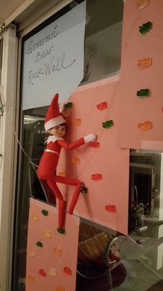 an elf is climbing up the side of a rock wall