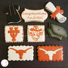 decorated cookies are arranged in the shape of texas, hats, and other items on a table