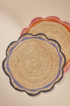 three woven placemats sitting on top of each other