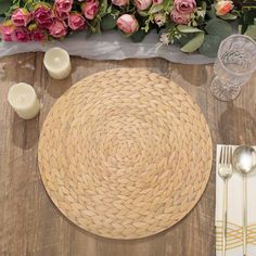 a place setting with flowers in the background