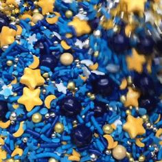 blue and gold confetti sprinkles are mixed together