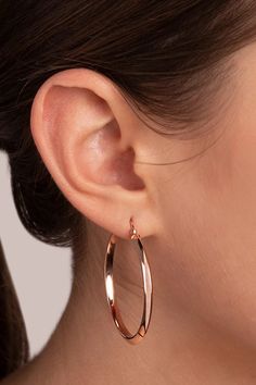 Handcrafted in Milan, Italy of 18K rose gold, this hoop earring's soft rich hue is created by an 18K rose gold alloy base plated with layers of lush 18K rose gold. Classic in look with a contemporary elongated design, this wardrobe builder is lightweight, features a pin and butterfly closure and is perfectly balanced for everyday wear. Each piece is handmade by Italian artisans, in small quantities, so you know that your jewelry is unique. 18K Rose Gold 1 3/4" Length 1/8" Width Patented Golden R Classic Rose Gold Earrings With Shiny Finish, Classic Shiny Finish Rose Gold Earrings, Modern Rose Gold Hoop Earrings For Everyday Wear, Rose Gold Hoop Earrings Shiny Finish, Rose Gold Hoop Earrings With Shiny Finish, Rose Gold Earrings With Shiny Finish For Gift, Rose Gold Earrings With Shiny Finish As Gift, Everyday Rose Gold Hoop Earrings, Elegant Pink Gold Hoop Earrings