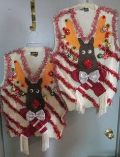 two vests are decorated with christmas decorations