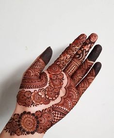 a hand that has some henna on it