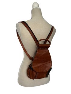 Vintage Womens 1970s Leather Brown Indian Bagpack Rucksack Embossed Tooled Ethnic Hippy Handprint, Zip pockets at the side with little compartments A lovely shaped bag Beautifully made, Lovely handle to wear as a mini bag also Measurements Length 14 Inch Width 9 Inch Vintage Standard Backpack For Trips, Vintage Leather Backpack For Trips, Vintage Brown Leather Backpack For Everyday, Vintage Satchel Backpack For Trip, Vintage Backpack For Travel, Vintage Rectangular Leather Backpack, Vintage Brown Leather Satchel Backpack, Vintage Leather Backpack With Adjustable Strap For School, Vintage Leather Shoulder Backpack For School