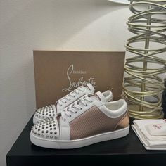 Brand New Designer White Sneakers With Perforations, Luxury White Custom Sneakers With Perforations, White Low-top Sneakers With Spikes, Luxury White Sneakers With Spikes, Luxury White Custom Sneakers With Red Sole, Luxury White Spiked Sneakers, White Spiked Round Toe Sneakers, Luxury White Sneakers With Red Sole, Louboutin Shoes