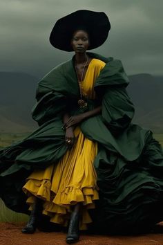 a woman in a yellow dress and black hat