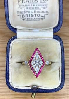 We have for sale a Wonderful Art Deco Ruby & Diamond Marquise Shaped Ring Circa 1930's. The ring consists of a channel set ruby design with diamonds. All of the ruby stones are nice and bright ruby red in colour. The diamonds on the ring are also all nice and bright white in colour and really complement the ruby gemstones. The dimensions of the head of the ring are 20mm by 15mm. The ring tests as 18ct yellow gold with the diamonds being set in white gold. The ring is in very good condition with Art Deco Ruby Ring With Diamond Details, Vintage Multi-stone Diamond Ring Collectible, Vintage Multi-stone Diamond Ring For Collectors, Vintage Multi-stone Diamond Ring For Gift, Hallmarked Oval Ruby Ring In Art Deco Style, Art Deco Hallmarked Oval Ruby Ring, Vintage Marquise Cut Gemstone Rings, Vintage Diamond Ring With Gemstones, Vintage Red Marquise-cut Jewelry