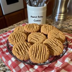 several peanut butter cookies on a wire rack