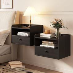 a nightstand with two drawers and a lamp on the end table next to a bed