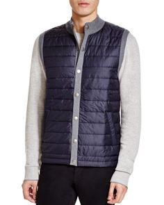 Barbour brainstormed this cozy layering vest as a color-blocked combo: navy puffer front, gray waffle-knit sweater back. Nylon Vest For Layering In Fall, Fall Layering Nylon Vest, Fall Nylon Vest For Layering, Gray Winter Vest For Layering, Casual Navy Outerwear For Layering, Navy Outerwear For Winter Layering, Navy Winter Outerwear For Layering, Vest Layering, Waffle Knit Sweater