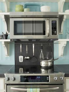 a stainless steel oven and microwave in a kitchen