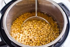 a pot filled with chickpeas on top of a stove