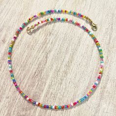 A B O U T - Dainty beaded choker/necklace made with a mix of colorful seed beads. - Carefully crafted to ensure durability so you can wear it everyday. - Perfect for layering with other necklaces or chokers, too! - Every single necklace is different and every bead will differ in size and shape. S I Z I N G - Made to order in your specified size. - Finished with an adjustable 1.5" chain extender. - Sizes 12" & 13" fit very close to the neck, 14" & 156" are a little looser, and sizes 16" & 17" fit Colorful Letter Beads For Festival, Festival Multicolor Letter Beads, Colorful Beaded Necklaces With Letter Beads For Jewelry Making, Multicolor Letter Beads For Jewelry Making, Rainbow Letter Beads For Festival, Colorful Letter Beads For Jewelry Making, Rainbow Heart Beads Necklace, Multicolor Heart Beaded Necklaces With Round Beads, Rainbow Beaded Necklace With Heart Beads