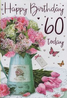 a birthday card with pink flowers in a watering can