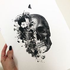 a drawing of a skull with flowers on it