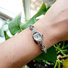 Vintage 10K RGP Classic Westhall 21 Jewels Dainty Marcasite Stretch Watch. Approx 6.5" around, stretchy. Untested. I sell found estate jewelry and therefore can make no guarantees that watches will work. Selling as is. Beautiful. . . . estate jewelry classy elegant gift gifts present presents stocking stuffers face case dial bezel face dial band model women womens women's woman womans woman's watches square shape shaped dainty analog white silver tone indices classic simple analog rolled gold pl Vintage Silver Diamond Watch With Accents, Silver Vintage Watch With Bracelet Strap, Antique Silver Watches With Subdials, Vintage Silver Watch With Subdials, Classic Collectible Analog Watch Accessories, Jewelry Classy, Women Wrist Watch, Square Shape, Vintage Accessories