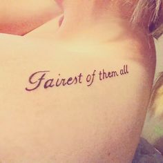 the back of a woman's shoulder that says, fairest of them all