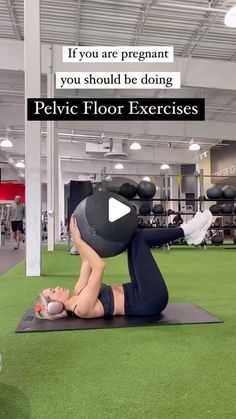 a woman is doing an exercise on a mat in the middle of a gym room