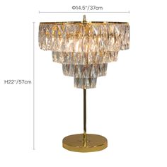 the golden table lamp is shown with measurements