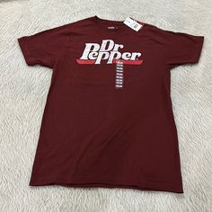 Dr Pepper Women’s T Shirt Size Medium, It’s New With Tag. The Shirt Comes From A Smoke Free Home. Pit To Pit: 19” Length: 28 1/2” Dr Pepper Shirt, David Bowie T Shirt, Mustard Yellow Top, Carhartt T Shirt, Dri Fit Shirt, Dr Pepper, Fit N Flare Dress, Crew Neck Tee, Linen Shirt