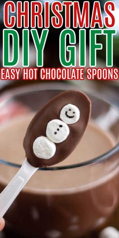 a chocolate spoon with marshmallows on it and the words christmas diy gift