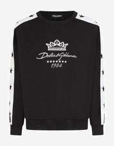 This black cotton Dolce & Gabbana sweatshirt features a ribbed round neck, dropped shoulders, long sleeves, an embroidered logo to the front, hem and cuffs, relaxed fit logo-embroidered contrasting stripes each sleeve. Jersey Sweater, Embroidery Videos, Star Embroidery, Leg Work, Walk In Wardrobe, Logo Sweatshirt, Embroidered Sweatshirt, Round Neck Sweaters, Cotton Logo