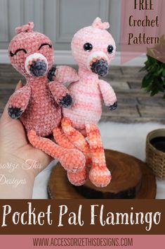 two crocheted stuffed animals sitting next to each other on top of a table