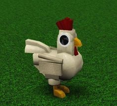 a white chicken standing on top of a green field