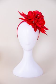 A sinamay disc embellished with three faux roses surrounded by beautiful faux red feathers. NO RETURNS/EXCHANGES due to the nature of the product (special occasions and headwear). Not all screens/lighting are created equal. Make sure you are happy with the color match before ordering! If you have any concerns, let us know! Sinamay, Faux Flowers, Faux Feathers, Satin Headband All Sales Final on Hats and Fascinators. Colors may vary on different devices. Adjustable Red Fascinator With Feathers, Red Adjustable Fascinator With Feathers, Adjustable Red Feathered Fascinator, Red Feathered Fascinator For Kentucky Derby, Red Feathered Mini Hat For Evening, Red Evening Mini Hat With Feathers, Red Feathered Fascinator For Wedding, Red Feathered Fascinator For Formal Occasions, Red Feathered Wedding Fascinator