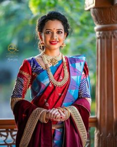 a woman in a red and blue sari