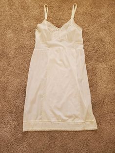 "Very pretty and simple 1950s Ivory Cotton Slip, Size Medium, Lace and Embroidered Bodice and Hemline. Soft gathers under the bodice. Adjustable Straps. In excellent condition without any stains, holes, rips, snags or odors. Wear this as a dress with some cowboy boots or sandals! Retro, Boho Measurements while laying flat: Bust 17\" (or 34 Bustline) Waist 15 1/2\" Hips 18\" Length 41\" No tags are present. I can tell by the straps and the stitching that this is 1950s As always, shipping is free Cotton Slip Dress, Cotton Nighties, Cotton Slip, Embroidered Bodice, Ivory Lace, Night Gown, Cowboy Boots, Camisole Top, Bodice