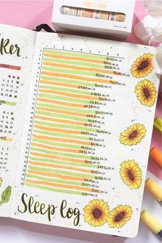 an open planner with sunflowers on it and the words sleep log written in cursive writing