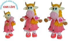 three stuffed animals dressed in pink and yellow outfits, one is wearing a cow's head