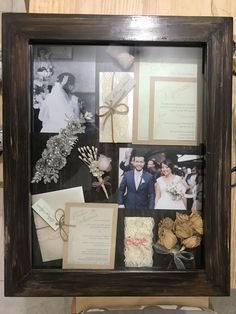 a wooden frame with wedding photos and other items