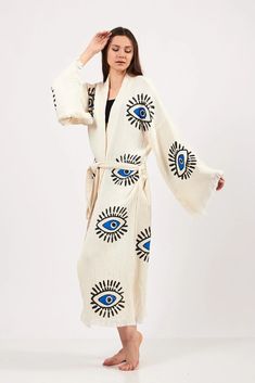 These kimonos are made from 4 layered cotton and that is why they are as soft as it can be. These kimonos are very versatile. You can combine them with jeans, pants, shorts... They are also great for beach and pool as they will dry quickly. These robes/kimonos are handcrafted in Turkey. The design on them is made with wood blocks by using plant-based dye. All the small details on the designs are handprinted one by one. It is 1 size fits all. It comes with a waist belt. Care Instructions: Machine Oversized Cotton Bohemian Kimono, White Traditional Kimono For Loungewear, Traditional White Kimono For Loungewear, White Cotton Kimono With Relaxed Fit, Beige Cotton Kimono For Festivals, Oversized Cotton Kimono For Festivals, Oversized Cotton Kimono For Spring, White Long Kimono One Size, White Long One-size Kimono