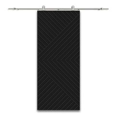 a black towel hanging on the side of a white wall next to a metal bar