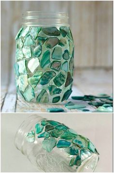 a jar filled with sea glass sitting on top of a table