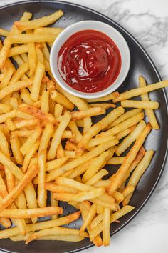 french fries with ketchup on a plate