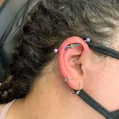 a woman with ear piercings on her ears