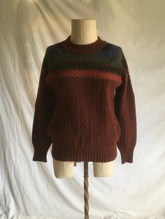 "vintage 1970s pullover sweater Renee Tener for Outlander 100% pure wool made in Hong Kong maroon w/ blue/green upper stripes kangaroo pocket good vintage condition, light wear label size M, see below measures, lying flat, shoulder-n/a, raglan cut chest-18\" sleeve from neck-27\" length-24\"" Retro Knitted Sweater For Fall, Brown Crew Neck Top With Fair Isle Pattern, Brown Long Sleeve Tops With Fair Isle Pattern, Retro Knitted Tops For Fall, Cozy Brown Tops With Fair Isle Pattern, Brown Fair Isle Long Sleeve Tops, Cotton Fair Isle Pattern Top For Fall, Cozy Brown Fair Isle Pattern Top, Cozy Brown Fair Isle Top