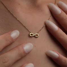 ✨ Capture Eternal Elegance: Discover Our Handmade 14K Gold Infinity Necklace ✨ 🌟 Step into a world of timeless elegance with our meticulously Handmade 14K Gold Infinity Necklace. Each piece is crafted with passion and precision, showcasing the artistry of our master jewelers and the allure of genuine 14K gold. This necklace isn't just an accessory--it's a symbol of infinite love, endless possibilities, and unwavering commitment. ✨ 🎁 Whether you're celebrating a milestone birthday, a special anniversary, or simply want to express your love and appreciation, our infinity necklace is the perfect choice. Its understated yet profound design speaks volumes, making it a cherished gift for her that she'll treasure for years to come. 💖 💫 Immerse yourself in the understated luxury of our infinit Symbolic Gold Infinity Jewelry, Symbolic Infinity Gold Jewelry, Symbolic Infinity-shaped Gold Jewelry, Infinity Symbolic Jewelry For Gift, Symbolic Infinity Jewelry For Gift, Symbolic Infinity Jewelry For Gifts, Gold Infinity Jewelry As A Gift For Her, Gold Infinity Jewelry Gift For Her, Gold Infinity-shaped Jewelry Gift For Her