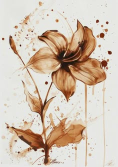 a drawing of a flower with watercolors on the side and brown paint splatters all over it